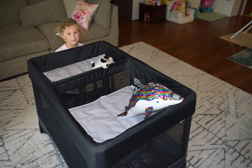 The 4Moms Breeze Plus with the changing pad and bassinet attached and stuffed animals in it