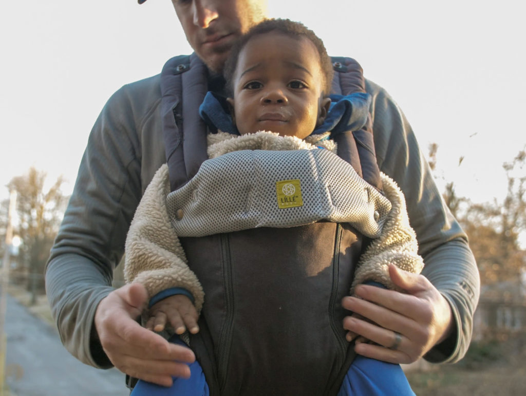 A baby in a Lillebaby Complete All-Seasons baby carrier